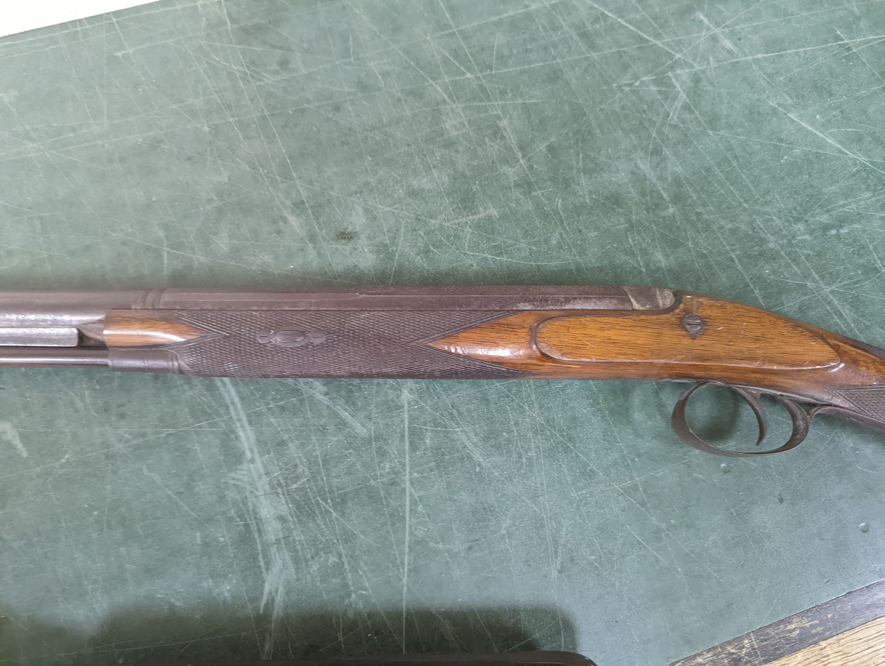 Two 19th century percussion muskets, 103cm. max., one double-barrelled